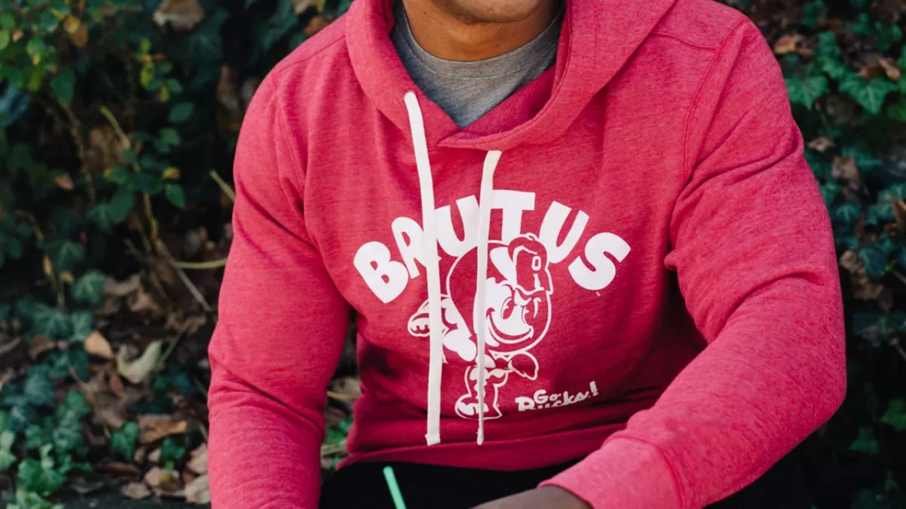 Model is wearing a red drawstring hoodie. With white block